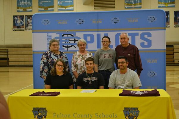 BOUND FOR CAMPBELLSVILLE - Fulton County Senior Chade Everett, front row, center, signed his letter of intent on May 6, to attend Campbellsville University for Baseball. Chade was joined by his parents, front row, Stephanie and Chad Everett; grandmothers, Telitha Fulcher and Rhonda Everett, sister, Taylor Everett, and grandfather, Chuck Everett. (Photo by Barbara Atwill)