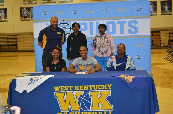 HEADING TO WKCTC – Fulton County High School Senior Dakyran “D.K.” Gossett, signed a Letter of Intent to attend West Kentucky Community and Technical College on May 6 to play basketball. D.K. parents, Tiffiney Gossett and Jason Smith, along with his siblings and WKCTC representative were in attendance. (Photo by Barbara Atwill)
