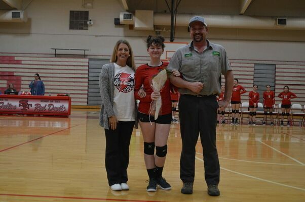SFMS VOLLEYBALL EIGHTH GRADE NIGHT HONORS – Shelby Stevens, #12, a member of the 2023 South Fulton Middle School Lady Red Devils' volleyball team, along with her parents, Keith Stevens and Emily Stevens, was honored during Eighth Grade Night recognition at the SFMS volleyball game March 2. (Photo by Benita Fuzzell.)