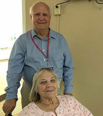 Fulton resident Wayne Lohaus is one of the “Friendly Visitor Volunteers”, who make visits each month at Fulton Nursing and Rehab Center visits with Carol Luker, one of the newest residents at Fulton Nursing and Rehabilitation. (Photo submitted)