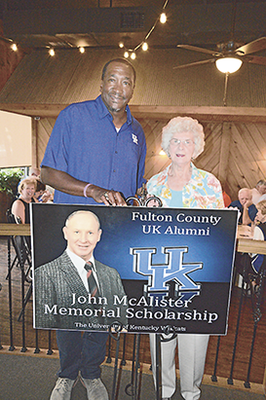WILDCAT PRIDE – Bettie McAlister was in attendance for the recent Fulton County UK Alumni banquet, and visited with guest speaker Jack "Goose" Givens. Her late husband, John McAlister, an avid supporter of the UK Wildcats and the local Alumni organization, has been memorialized with the annual scholarships presented bearing his name. (Photo by Benita Fuzzell)