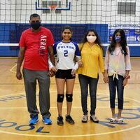 Senior Hannah Patel was escorted by Naresh Patel and Tejal Pate. (Photo by Benita Fuzzell)