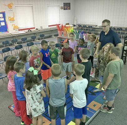 Pictured is Cody Pinson, the new music teacher at Hickman County Elementary School, playing a game to help him get to know students and vice versa. (Photo submitted)