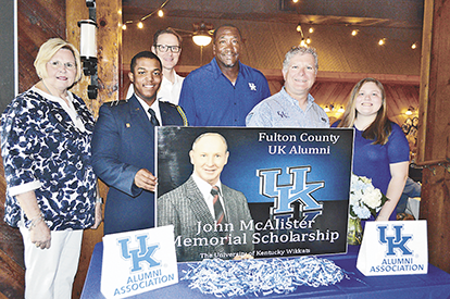BIG BLUE BENEFICIARIES – Tristan Roberson, second from left and Sarah Gardner, far right, were awarded $1,000 scholarships May 31, by the Fulton County University of Kentucky Alumni group, during the organization's annual Scholarship Banquet held at The Keg restaurant in Fulton. Gardner, a Hickman County High School graduate, received the scholarship for the second time, and will be returning to UK, as an English major. Roberson, who was home schooled, will return to UK as a junior this Fall. Anyia Jones, a 2018 Fulton High School graduate was also a scholarship recipient but was unable to attend the banquet. Those interested in contributing to the scholarship fund may forward donations to Bob Mahan or Mallory Worley at Heritage Bank of Fulton. The scholarships are named in honor of longtime UK supporter, the late John McAlister. Also pictured, from left are Brenda Mahan, scholarship coordinator, Roberson, Tim Walsh, UK Alumni Association, guest speaker and former UK standout, Jack "Goose" Givens, Fulton County UK Alumni president Alan Jones and Gardner. Over 90 people attended this year's banquet. (Photo by Benita Fuzzell)