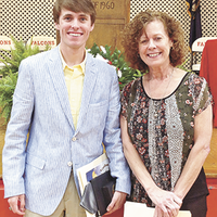 River Valley Ag Credit Scholarship was awarded to Jakob Stahr, left, by Patricia Kelly, right, at the recent Hickman County High School Honors Night. Stahr also received the St. Jude Catholic’ Church Scholarship, and the Hickman County Farm Bureau Scholarship. (Photo submitted)