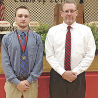 Joseph Porter, left, was recognized for enlisting in the Kentucky National Guard at the recent Hickman County High School Hon-ors Night. Shane Bizzle, right, was the presenter. (Photo submitted)