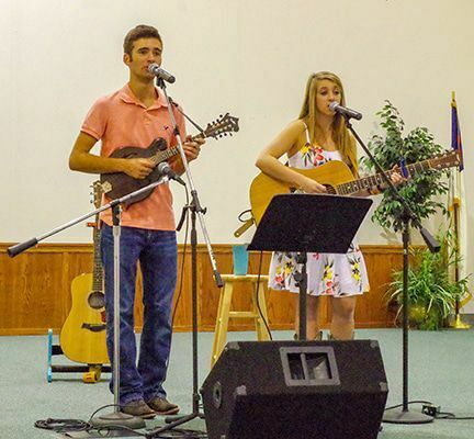 Hunter and Carson Wright provided the entertainment at the Farm to Fork dinner at the First Assembly of God Church in Clinton Aug. 10. (Photo by Becky Meadows)