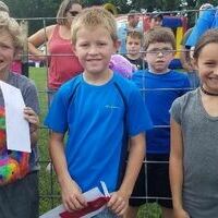Second-Third grade Greased Pig Contest winners -- Joseph Russell, Carson Gilbert and Samantha Mann were the fastest pig chasers in this year's Banana Festival Greased Pig contest Saturday, in the second through third grade division.