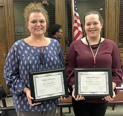 FIS TEACHERS OF THE MONTH – NaKia Brown, left, and Stephanie Fulcher, were named Teachers of the Month for December during the Fulton Independent BOE meeting Jan. 8. Brown teachers first grade at Carr Elementary and Fulcher teaches at Fulton Middle/High School. (Photo by Benita Fuzzell)