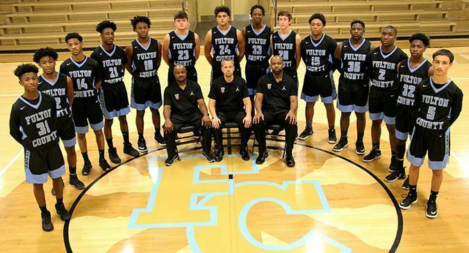 2019-20 PILOTS – The Fulton County Pilots basketball team will feature 14 players on the varsity roster. Pictured are team members, left to right, Corey Smith II, Webbie Turner, Josh Cole, KJ Couch, Armani Yandal, Broc Bridges, Dylan Hammond, Wesley Brown, Hayden Murphy, DiAvian Bradley, Jerome Warren, Caleb Kimble, JaQuan Warren and Colton Henderson. Coaching staff, left to right, Corey Smith Sr., head coach Jamie Madding, and Craig Clay. (Photo  by Charles Choate)