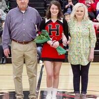 SENIOR FALCON CHEERLEADER HONORED – Gabby Collins, along with her parents, Perry and Shannon Collins, were recently honored during Hickman County High School’s Senior Night. (Photo by Becky Meadows)
