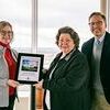 Education Director Polly Brasher and Discovery Park President and CEO Scott Williams present Alice Fennel with the 2019 Volunteer of the Year Award at a volunteer luncheon in the Cooper Tower Feb. 13. (Photo submitted)