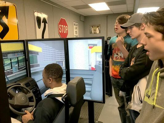 Hickman County students in Brad Tucker’s automotive class practice their driving skills in the Fulton County Transit Authority Driving Simulator. Fulton County Transit Authority sponsored the Driver Safety Simulator recently, at the Four Rivers Career Academy in Hickman. (Photo submitted)