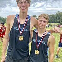 VARSITY BOYS 5000 METER RUNNERS – Cameron Aldridge, left, and Isaac Madding, right, were Fulton County’s highest placing runners in the Calloway County Invitational held Sept. 8 at Calloway County High School. Aldridge finished in 11th place, and Madding sixth place. (Photo submitted)