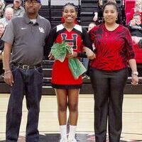 SENIOR CHEERLEADER RECOGNIZED – Makayla Hardin, along with her parents, Jarvis and Paulette Wilson, were recently honored during Hickman County High School’s Senior Night. (Photo by Becky Meadows)