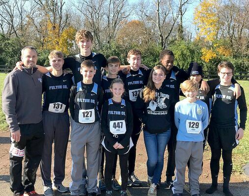 STATE COMPETITORS – Fulton County’s Cross Country team members attending the Kentucky State Cross Country Meet at New Horse Park in Lexington on Nov. 3 were front row, from left, Daniel Collins, Emma Madding, Callie Coulson, and Logan Griffith; back row, from left Coach Jamie Madding, Isaac Madding, Camden Aldridge, Chade Everett, Hayden Murphy, Wesley Brown, Harrison Posey, and Luke Jackson. (Photo submitted)