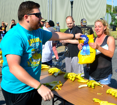 BANANA FESTIVAL COMMITTEE MEMBER KYLE CRAWFORD "CROWNED" JEANA COOK OF SOUTH FULTON THE WINNER IN THE 2019 BANANA FESTIVAL BANANA EATING CONTEST THIS MORNING...COOK CONSUMED FOUR BANANAS IN ONE MINUTE, THE MOST EATEN AMONG EIGHT CONTESTANTS. (PHOTO BY BENITA FUZZELL.)