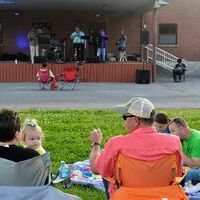 SUMMER’S GOOD FOR THE ‘SOUL’ – Families enjoyed a perfect evening at Fulton’s Pontotoc Park May 1, when the Fulton Tourism Commission’s first in a series of free Summer concerts was staged, featuring “Soul Dog”. (Photo by Benita Fuzzell)