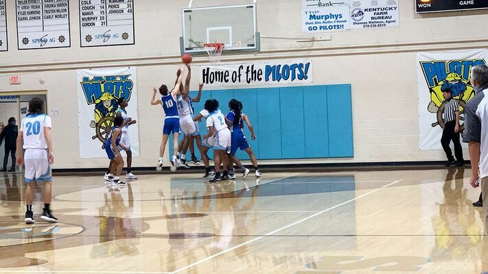 A host of Pilots and Blue Tornadoes battle for a rebound during their game Jan. 15. (Photo by Mark Collier)