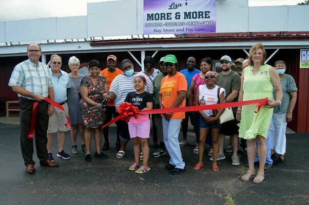 A large group of family, friends and Chamber members were on hand for last week’s Ribbon Cutting for Lisa’s More &amp; More. (Photo by Benita Fuzzell)