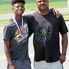 GOLD FAMILY – Corey Smith Jr., left, took home a gold medal in the latest KHSAA State Track and Field Championships. With Smith’s win in the triple jump, he became the third member of his family to capture a state gold medal. Smith’s father, Corey Smith Sr., right, won the long jump 29 years ago, and still holds the state record. Smith’s sister, Sharika, won 14 state gold records and still holds state records in the 200 meter run and triple jump. (Photo by Charles Choate)
