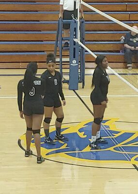 Fulton High School Volleyball team members Jada Martin, #9, Jasmine Reeves, #8 and Kereni Ware prepare for a rally during the FHS matchup and ultimate victory against St. Mary Aug. 24. (Photo submitted)