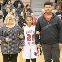 SFMS BASKETBALL EIGHTH GRADE NIGHT – Shaylynn Brown, a member of the South Fulton Middle School Lady Red Devils basketball team, accompanied by her mother, Traci Ramsey, and Jordan Brown, were recognized during Eighth Grade Night at SFMS gym last week.
