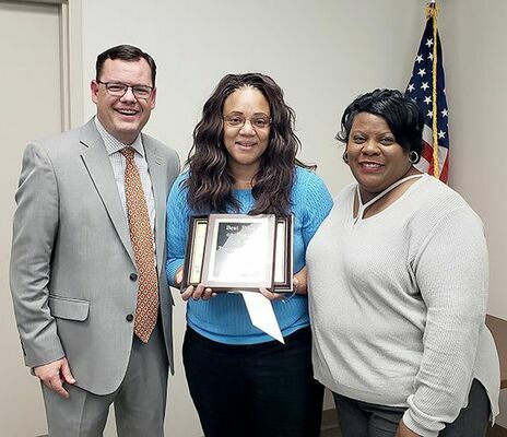 BEST PILOT ON BOARD – Fulton County School’s Board of Education presented Tiea Cross-Davis with the Best Pilot on Board award during their Dec. 17 meeting. Pictured from left are Superintendent Aaron Collins, Cross-Davis, and Board Chairperson Kimberly Hagler. (Photo by Barbara Atwill)