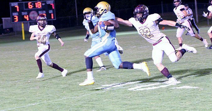 BIG NIGHT – Fulton County running back Caleb Kimble looks for running room during the Pilots home game against Webster County. Kimble rushed for 408 yards on 25 carries, and scored four touchdowns. The Pilots won the game 62-46. (Photo by Charles Choate)