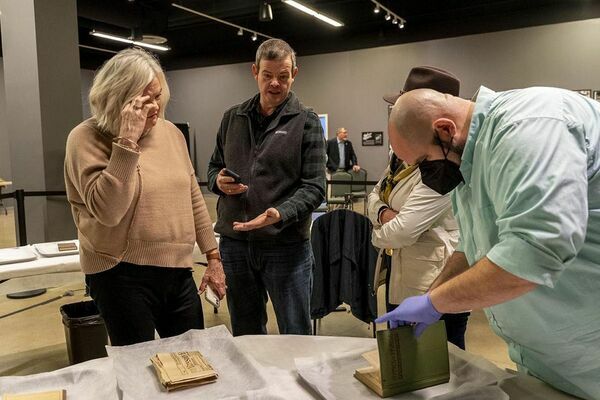 MEMBERS OF DRESDEN'S METHODIST CHURCH WERE ON HAND AT DISCOVERY PARK FEB. 2 FOR THE OPENING OF THE RECENTLY DISCOVERED CORNERSTONE FROM THE CHURCH BUILDING