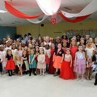 PRINCESSES OF ALL AGES – Approximately 100 Pilot Princesses gathered for a group picture during the Tiaras and Ties Father/Daughter Dance held at Fulton County Schools Feb. 15. The young Princesses were excited to dance the night away with their fathers and their friends. (Photo by Barbara Atwill)