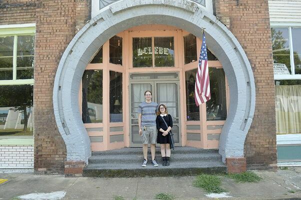 NEW LIFE FOR LACLEDE – Antti Williams and Heather Sidberry of Tampa, Fla., stand in front of the LaClede Hotel in downtown Hickman. Williams has bought the LaClede and plans to have it in operation for the holidays in 2019. (Photo by Barbara Atwill)