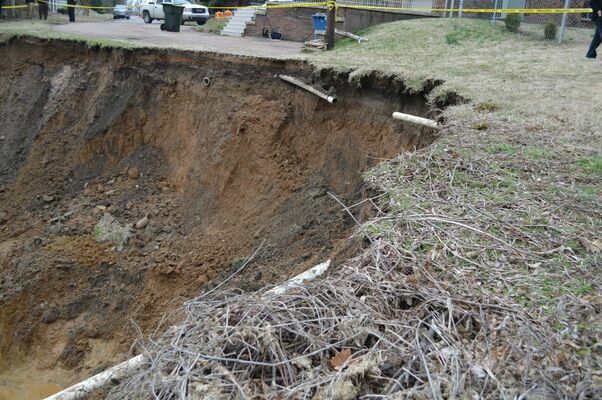 EXPOSED - Water lines are exposed following the landslide in Hickman Feb. 20. The slide is approximately 26 feet from the Hickman Methodist Parsonage and 27 feet from their Life Enrichment Center. (Photo by Barbara Atwill)