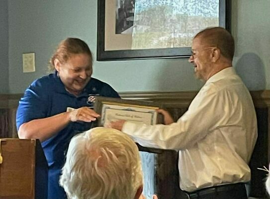 Incoming Rotary President Dave Puckett presented outgoing President DeAnna Miller with a crystal gavel for her accomplishments during her presidency. (Photo submitted)