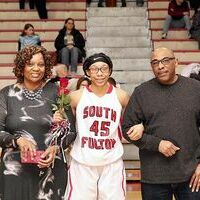 CELEBRATING SENIORS AT SOUTH FULTON HIGH SCHOOL – Venise Quinn, a senior SFHS Lady Red Devil, was recognized during the Senior Night ceremonies Feb. 13, in the high school gym. Escorting Quinn were her parents, Gary and Saundra Quinn. (Photo by Jake Clapper)