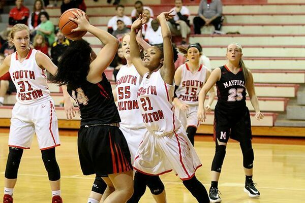 SURROUNDED – A Mayfield Lady Cardinal is surrounded by South Fulton's CaShaya McClerkin, Sophia Hodges and Allison Murphy during court action Jan. 9, with the Lady Devils falling just short of the win, 28-20, to the Lady Cardinals. (Photo by Jake Clapper)