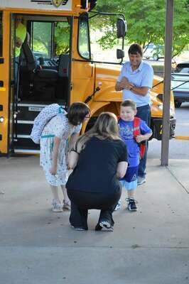 A WARM WELCOME – There’s nothing better than a warm welcome and greetings with a smile to comfort a student when arriving for the first day of school. South Fulton Elementary bus riders were met by teachers as they arrived for the first day of class for the Obion County School System Aug. 2. (Photo by Benita Fuzzell)