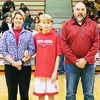 Berrett Watkins, center, was recently honored for Basketball during Eighth Grade Night at South Fulton Middle School. Watkins’ parents, Leah and Buck Watkins, escorted their son.