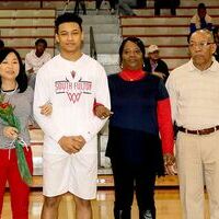 SOUTH FULTON HIGH SCHOOL SENIOR NIGHT – Blake Johnson, second from left, along with his mother and grandparents, were recognized at Senior Night ceremonies recently, which honored senior basketball players for the Red Devils. (Photo by Jake Clapper.)