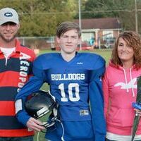 MS BULLDOGS RECOGNIZED – Pictured is Fulton Independent Middle school 8th grade football player Jacob Madding, center, and his parents, Jason and April Madding. Madding was honored at the recent Eighth Grade Night. (Photo submitted)