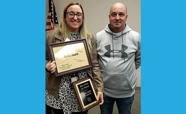 RECEIVES BEST PILOT AWARD – Katie Smith, left, receives the Best Pilot on Board award during the Fulton County Board of Education Special Called Meeting Feb. 13. (Photo by Barbara Atwill)