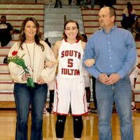 SENIOR LADY RED DEVIL HONORED – Senior Lady Red Devil girls’ basketball team member Amber Lemon, center and her parents were recently recognized during Senior Night ceremonies at South Fulton High School. (Photo by Jake Clapper.)