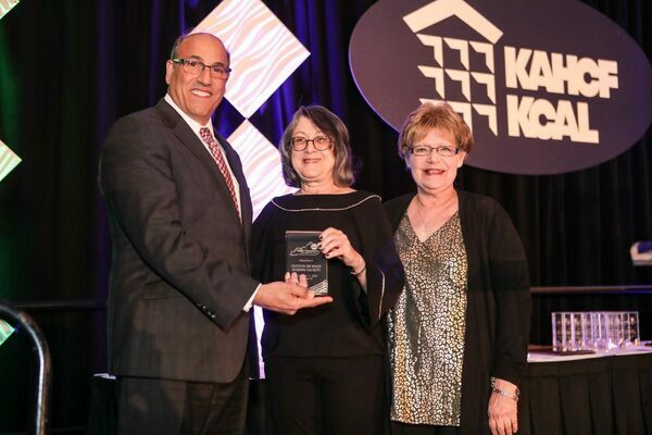 Accepting the Best of Kentucky Award from Joe Mashni with Med Care Pharmacy is Jennifer Connell, ICF Administrator, middle, and Kim Radford, Infection Preventionist/Admissions Nurse, right. (Photo submitted)