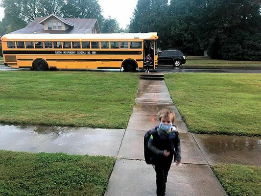 INAUGURAL BUS RIDE –  Fulton Independent students made history, shown in this photo appearing in the Oct. 14 edition of The Current, utilizing the district’s newly established door to door bus transportation to and from school campuses.
