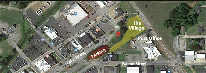 ‘TINY VILLAGE’ COULD BE BIG TOURISM DRAW – This aerial view of the downtown area of Fulton, including Lake Street, Walnut Street and the Fulton Post Office, also shows a proposed site for a miniature shopping “Village” with shops housed in prefabricated shed-like structures. Fulton City Manager Mike Gunn presented the idea to Fulton’s Tourism Commission last week.