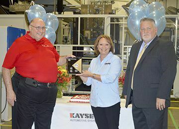 Dennis Poker with GM made the award presentation to Kayser employees last week. (Photo by Benita Fuzzell)
