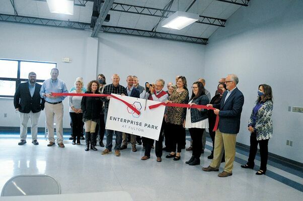 BRANDED – Community leaders and officials were on hand Oct. 20 for a ribbon cutting to unveil the new name and logo, Enterprise Park at Fulton, formerly known as Fulton Industrial Park, as shown in this photo published in the Oct. 21 edition of The Current.