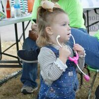 WHAT'S YOUR HEART SOUND LIKE - A Youngster at the Hickman Pecan Festival uses her stethoscope to check vitals during the Hickman Pecan Festival held Oct. 22, at Jeff Green Memorial Park in Hickman. (Photo by Barbara Atwill)