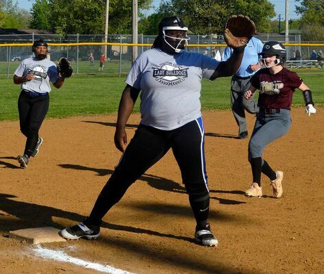 Lady Bulldog Takyra Taylor attempts the play at third, to stop a Lady Comet’s advance.