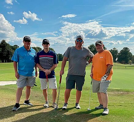 PREMIER PLACES THIRD – Premier Portable Buildings Team # 4, donated their third place winnings back to the Chamber during the annual fundraiser golf scramble held Oct. 2. Pictured left to right are team members Chris Johnson, Dustin Johnson, Kenny Johnson and Kevin Irons. (Photo submitted)